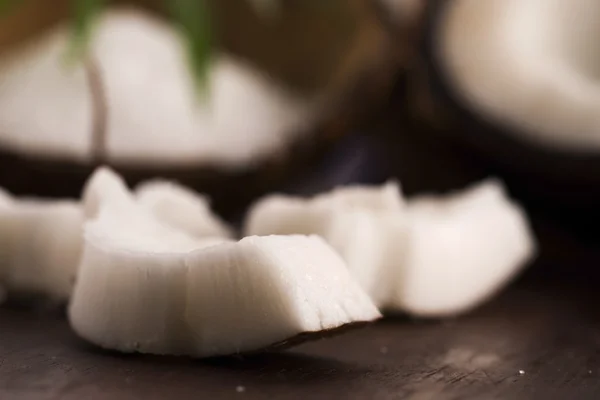 Close up of a coconut on a wooden background — Stock Photo, Image