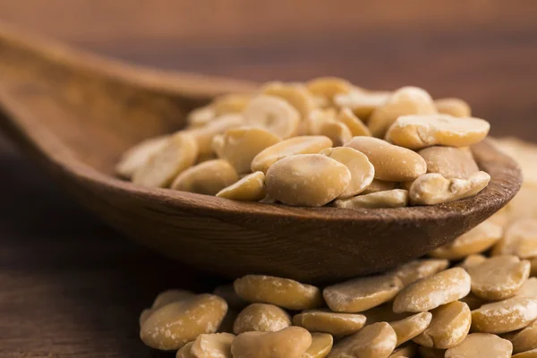 Broad bean dry on wooden table — Stock Photo, Image