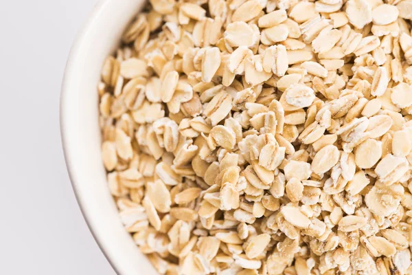 Copos de avena en tazón —  Fotos de Stock