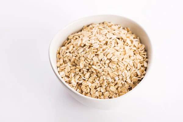 Oat flakes in bowl — Stock Photo, Image