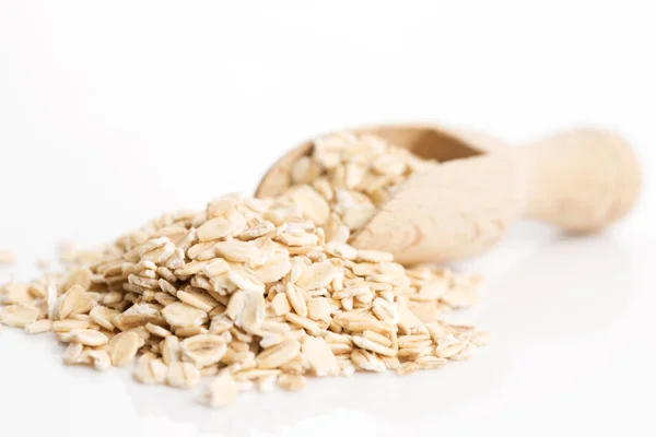 Oat flakes pile on white background — Stock Photo, Image