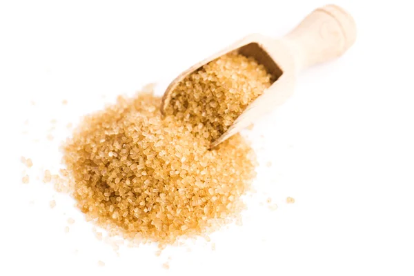 Crystals cane sugar heap close up isolated on white — Stock Photo, Image