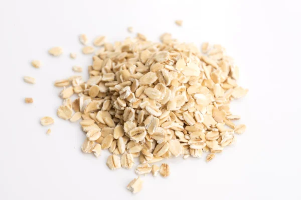 Oat flakes pile on white background — Stock Photo, Image