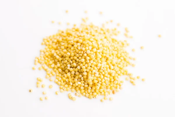 Heap of millet groats on white — Stock Photo, Image