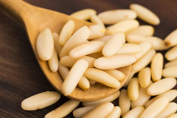 Dry Organic Pine Nuts on Wooden Background — Stock Photo, Image