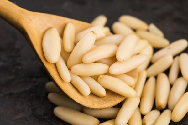 Dry Organic Pine Nuts on Wooden Background — Stock Photo, Image