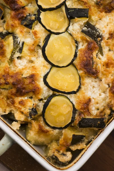 Casserole with cheese and zucchini in baking dish — Stock Photo, Image