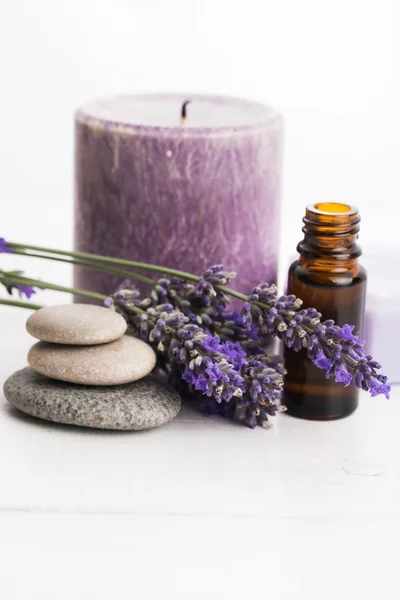 Essential oil and lavender flowers — Stock Photo, Image