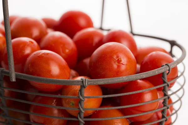 Cherry tomatoes in basket — Stock Photo, Image