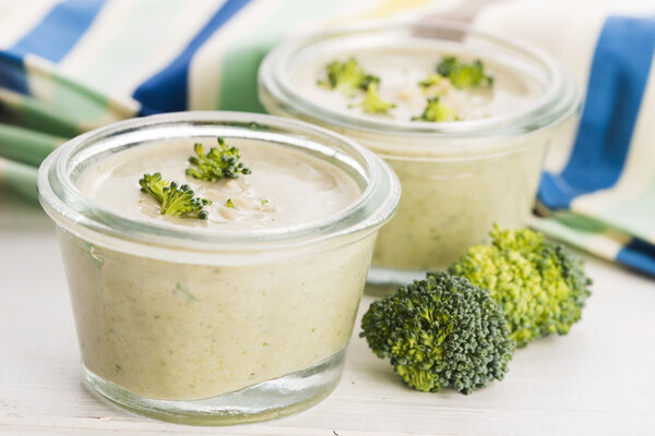 Broccoli cream soup on table