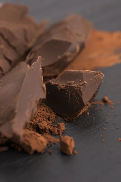 Chopped chocolate with cacao — Stock Photo, Image