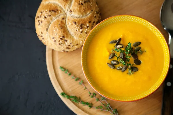 Close Vegan Homemade Pumpkin Soup Seeds Herbs Bun Black Background — Stock Photo, Image