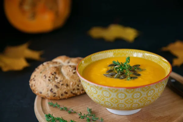 Close Autumn Vegan Homemade Pumpkin Soup Seeds Herbs Bun Black — Stock Photo, Image