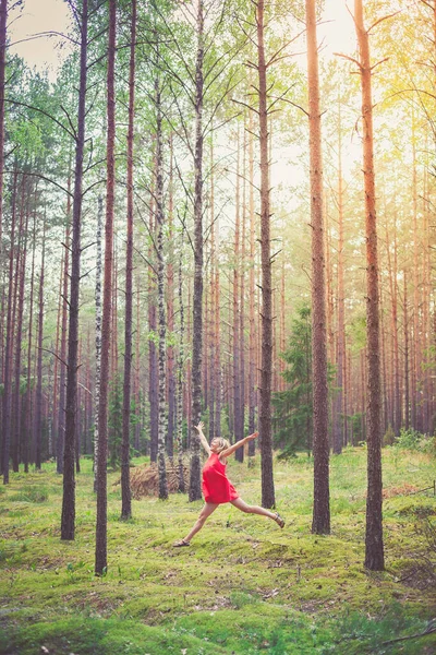 Young Happy Blond Woman Red Dress Jumping Pine Forest — Stock Photo, Image