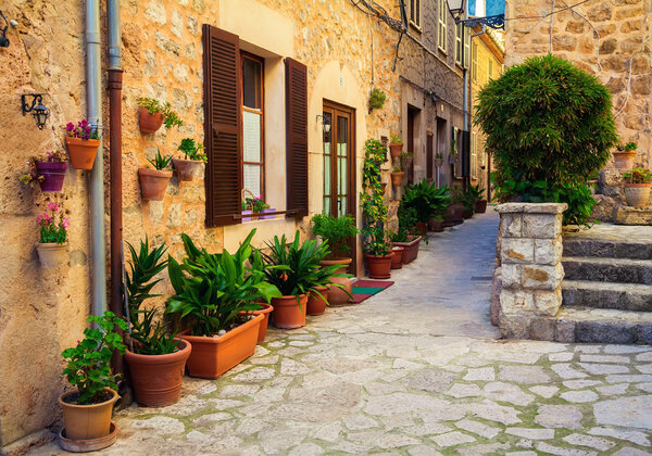 Typical view of the street with flower pots in village Valldemossa, Mallorca, Spain