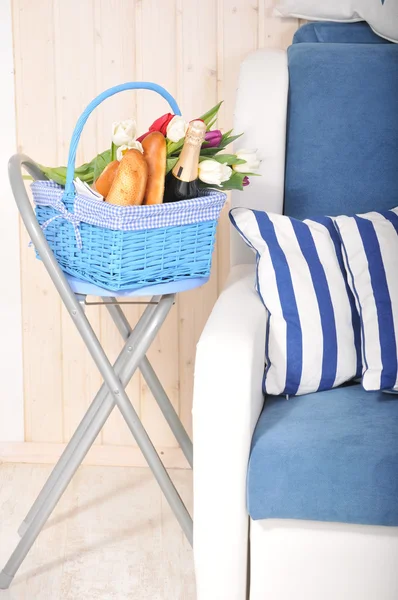 Basket with flowers and  champagne — Stock Photo, Image