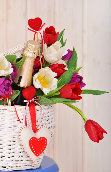 Basket with flowers and  champagne — Stock Photo, Image