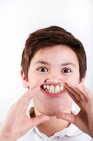 Boy holding a magnifying glass to his mouth — Stock Photo, Image