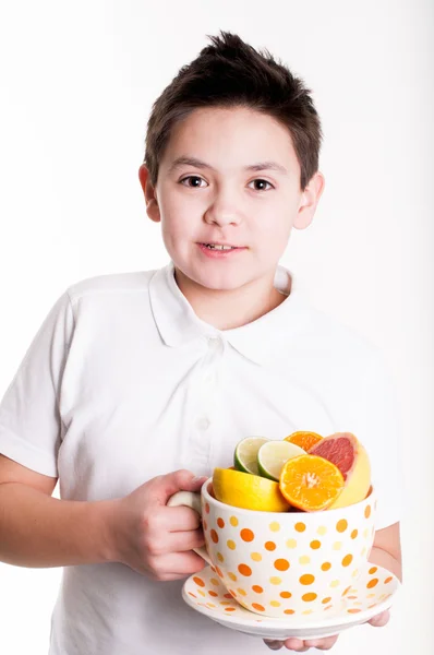 Boy drinks orange juice — Stock Photo, Image