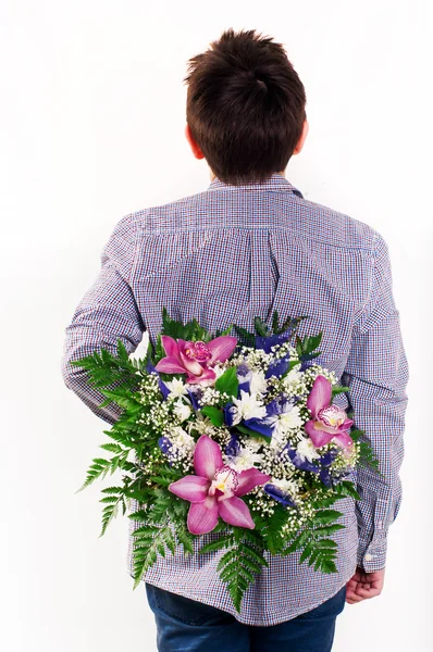 Chłopiec z kwiatami — Zdjęcie stockowe