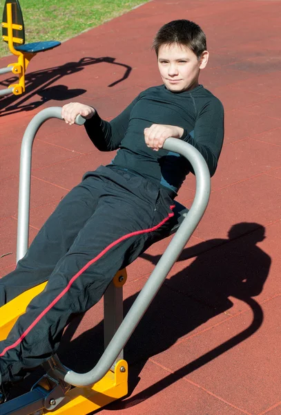 The boy on outdoor sport ground — Stock Photo, Image