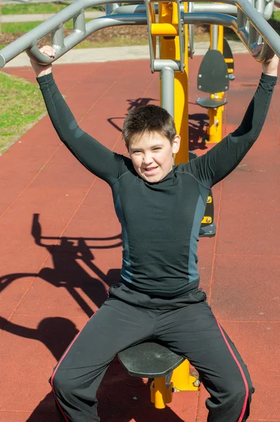 The boy on outdoor sport ground — Stock Photo, Image