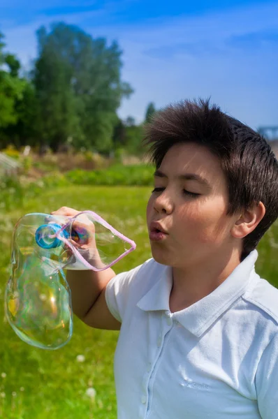 Boy and soap bubbles — Stock Photo, Image