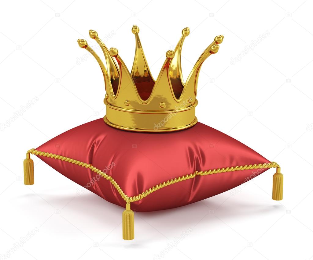 Golden king crown on the red pillow