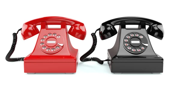İzole kırmızı ve siyah eski moda telefonları — Stok fotoğraf