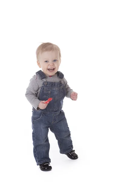 Baby girl in overalls — Stock Photo, Image