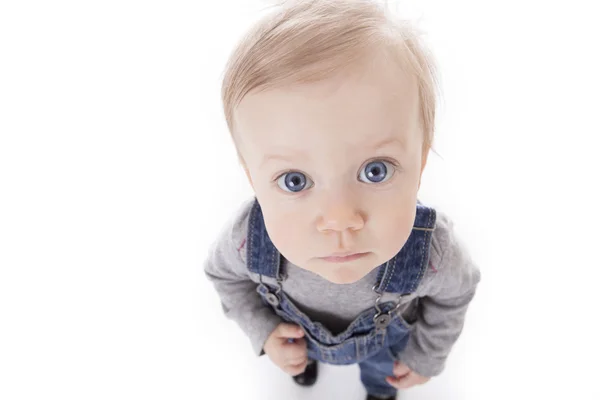 Baby girl in overalls — Stock Photo, Image