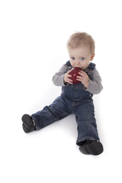 Baby girl in overalls — Stock Photo, Image