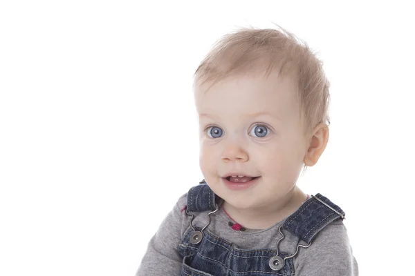 Baby girl in overalls — Stock Photo, Image