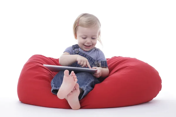 Toddler girl tablet Stock Image