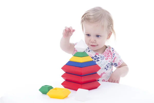 Toddler girl stacking blocks Stock Picture