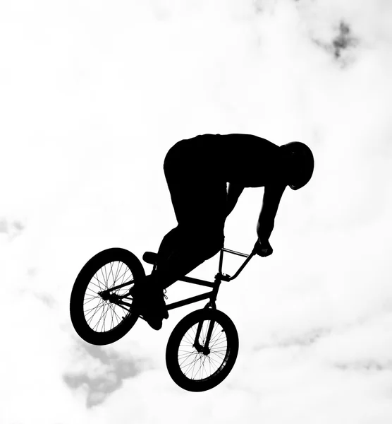 Silhouette of bmx riders in action — Stock Photo, Image