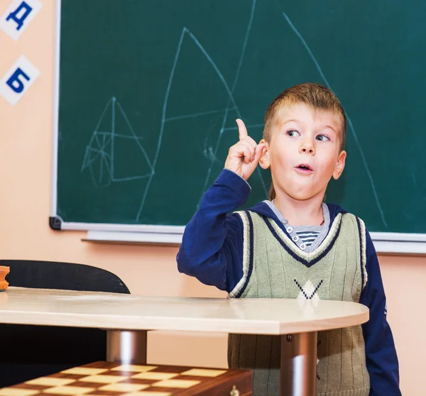 School boy in classroom at lesson — Stock Photo, Image