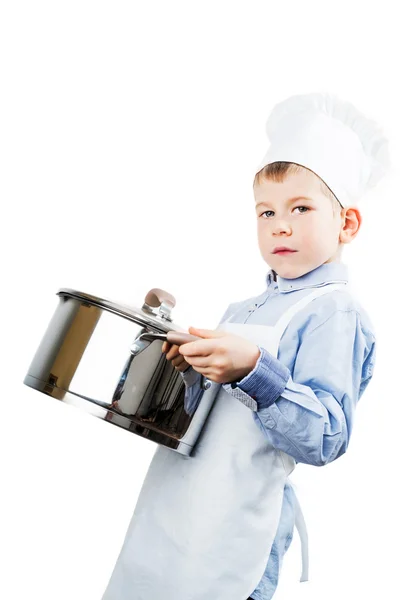 Kleiner Junge, gekleidet wie ein Koch beim Abendessen — Stockfoto