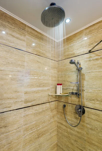 Bright and white bathroom with white tub, beige tile floor, glass door shower — Stock Photo, Image