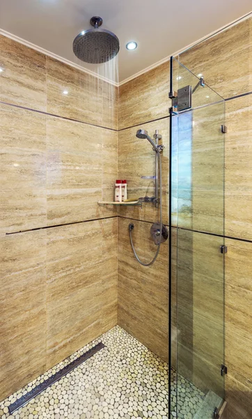 Bright and white bathroom with white tub, beige tile floor, glass door shower — Stock Photo, Image