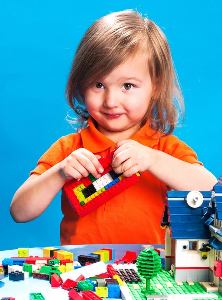 Child playing with construction blocks — Stock Photo, Image