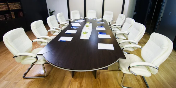 conference room with big round table and chairs