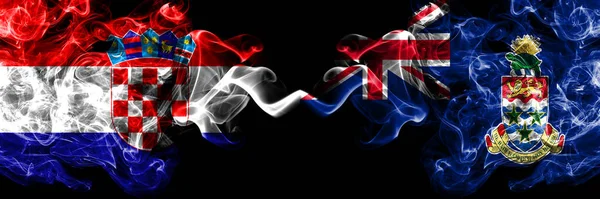 克罗地亚 克罗地亚对英国 开曼群岛烟熏神秘的旗帜并排放置 浓密的彩色丝状抽象烟旗 — 图库照片