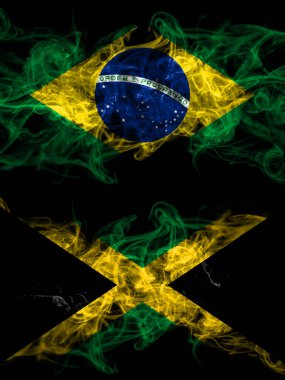 Brezilya, Brezilya Jamaika 'ya karşı, Jamaika' nın dumanlı mistik bayrakları yan yana. Kalın renkli ipeksi soyut duman bayrakları.