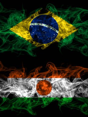 Brazil, Brazilian vs Niger, Nigerien smoky mystic flags placed side by side. Thick colored silky abstract smoke flags.