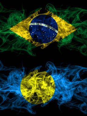 Brazil, Brazilian vs Palau smoky mystic flags placed side by side. Thick colored silky abstract smoke flags.