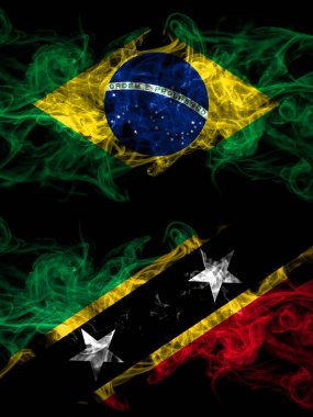 Brazil, Brazilian vs Saint Kitts and Nevis smoky mystic flags placed side by side. Thick colored silky abstract smoke flags.