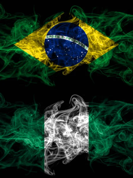 Brazil, Brazilian vs Nigeria, Nigerian smoky mystic flags placed side by side. Thick colored silky abstract smoke flags.