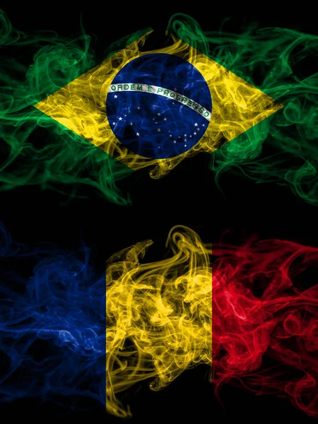 Brazil, Brazilian vs Romania, Romanian smoky mystic flags placed side by side. Thick colored silky abstract smoke flags.