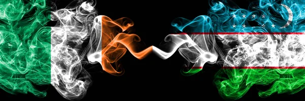 Ирландская Республика Ирландия Против Узбекистанского Дымного Мистического Флага Размещенного Бок — стоковое фото
